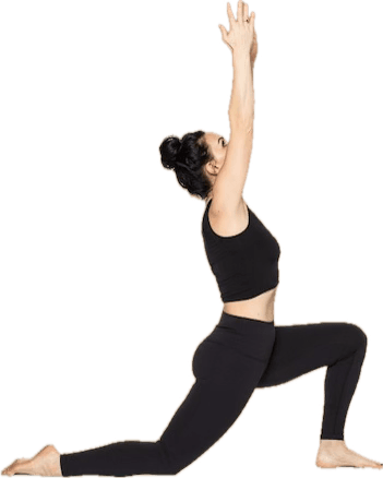 A student in a crescent lunge with both arms reaching overhead